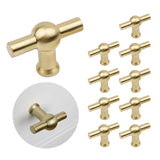 Un ensemble de dix boutons Rando Gold 10x de yessential.fr ; un bouton doré est installé sur un tiroir blanc en bas à gauche.
