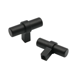 Deux boutons Arturo Black noir mat de yessential.fr, avec de courtes tiges rectangulaires, sont présentés sur un fond blanc - parfaits pour une cuisine moderne ou comme ferrures d'armoires élégantes.