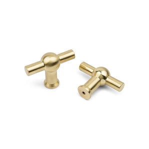 Deux boutons Rando Gold de yessential.fr présentent une conception et une forme de forme de cylindres sur un socle rond, représentatif d'un socle blanc - idéal pour un style de décoration intérieure moderne.