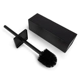 L'ensemble WC noir Lazzo (sans perçage) de yessential.fr se compose d'une brosse WC noire avec un manche rectangulaire et d'une boîte de support assortie, tous deux faisant partie d'un ensemble d'accessoires de toilette noir, présenté sur fond blanc.