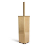 L'ensemble de toilettes Lazzo Gold de yessential.fr est doté d'une brosse de toilette moderne en or avec une base rectangulaire et une poignée cylindrique - aucun perçage requis. Parfait pour les ensembles d'accessoires de salle de bain élégants, il se dresse contre n'importe quel décor.