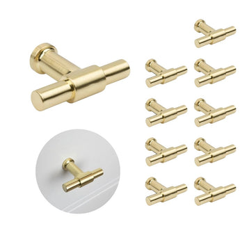 Le jeu de 10 boutons Cordero Gold de yessential.fr est doté de boutons modernes et cylindriques de couleur dorée. Un bouton est affiché séparément et un autre installé sur un tiroir blanc - idéal pour améliorer vos armoires de cuisine.