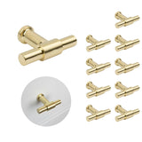 Le jeu de 10 boutons Cordero Gold de yessential.fr est doté de boutons modernes et cylindriques de couleur dorée. Un bouton est affiché séparément et un autre installé sur un tiroir blanc - idéal pour améliorer vos armoires de cuisine.