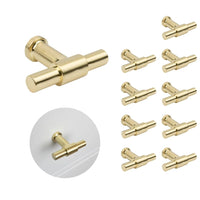 Le jeu de 10 boutons Cordero Gold de yessential.fr est doté de boutons modernes et cylindriques de couleur dorée. Un bouton est affiché séparément et un autre installé sur un tiroir blanc - idéal pour améliorer vos armoires de cuisine.