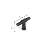 Le bouton noir Cordero de yessential.fr présente une conception de barre en T cylindrique noire, mesure 56 mm de large et 41 mm de haut, a une finition noire mate et est représenté sur un fond blanc.