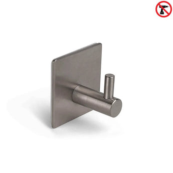 Le Navarro Gunmetal de yessential.fr est un crochet autocollant en acier inoxydable avec une base carrée et une broche cylindrique, illustré en blanc. Une icône rouge « sans perçage » en haut à droite souligne l'installation simple et sans perçage.