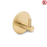 Le Rudro Gold de yessential.fr est un crochet porte-serviettes cylindrique doré à base ronde. Une icône sans perçage indique qu'il s'agit d'un crochet à serviette sans perçage, ce qui rend l'installation facile – aucun perçage requis.