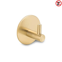 Le Rudro Gold de yessential.fr est un crochet porte-serviettes cylindrique doré à base ronde. Une icône sans perçage indique qu'il s'agit d'un crochet à serviette sans perçage, ce qui rend l'installation facile – aucun perçage requis.