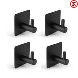 Les 4x Navarro Black de yessential.fr sont des crochets à serviettes autocollants noirs avec une plaque arrière carrée moderne, dotés d'un design « sans perçage » pour une installation facile sans outils.