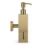 Le distributeur de savon mural Sonego Gold de yessential.fr présente un design rectangulaire élégant de couleur dorée, un dessus de pompe et une fenêtre verticale pour afficher le niveau de savon - idéal pour les salles de bains élégantes et modernes.