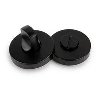 Le support WC yessential.fr Rodi Black - un service pour le rond noir avec un tour de rotation et un service pour le WC et une partie inoxydable pour les pièces de la monnaie du tournevis - sont présentés sur un fond blanc.