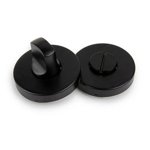 Le support WC yessential.fr Rodi Black - un service pour le rond noir avec un tour de rotation et un service pour le WC et une partie inoxydable pour les pièces de la monnaie du tournevis - sont présentés sur un fond blanc.