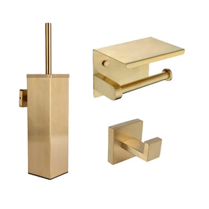 L'ensemble WC Verano Gold de yessential.fr dispose d'accessoires modernes de couleur dorée : un ensemble brosse WC carré, un porte-papier toilette avec étagère et un double crochet carré pour peignoir, le tout dans une finition or brossé.