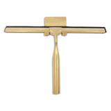 La Zamoro Gold de yessential.fr est une raclette de douche en acier inoxydable de couleur dorée dotée d'une lame en caoutchouc noir, affichée sur fond blanc.