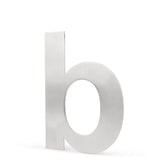 L'Adamo Stainless Steel 15cm de yessential.fr est un b minuscule métallique avec une finition argent brossé, inspiré des numéros de maison élégants, et se tient debout sur un fond blanc.
