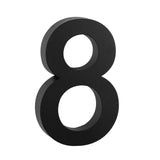 L'Angelo Black 30 cm de yessential.fr est un grand numéro de maison 3D saisissant huit en noir, debout sur un fond blanc - idéal pour les amateurs de numéros de maison modernes et élégants.