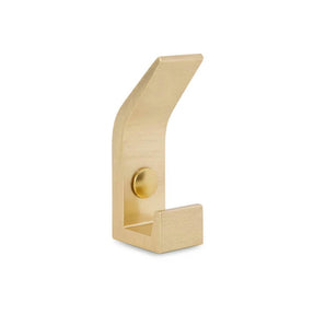 Le porte-manteau Huso Gold de yessential.fr a un design moderne et angulaire et est monté sur un fond blanc, ce qui en fait un ajout élégant à n'importe quelle pièce.