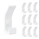 Le 10x Huso White de yessential.fr comporte dix patères blanches identiques dans un style moderne et minimaliste - idéal pour un intérieur scandinave. À gauche, une parenthèse est détaillée, à droite, neuf parenthèses dans une grille.