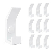 Le 10x Huso White de yessential.fr comporte dix patères blanches identiques dans un style moderne et minimaliste - idéal pour un intérieur scandinave. À gauche, une parenthèse est détaillée, à droite, neuf parenthèses dans une grille.