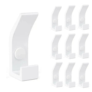 Le 10x Huso White de yessential.fr comporte dix patères blanches identiques dans un style moderne et minimaliste - idéal pour un intérieur scandinave. À gauche, une parenthèse est détaillée, à droite, neuf parenthèses dans une grille.