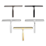 Cinq essuie-glaces de douche Zamoro Gold de yessential.fr sont disposés sur un fond blanc. Ils ont chacun un design moderne et élégant avec un dessus horizontal et sont livrés avec un système de suspension 3M pratique pour un rangement facile.