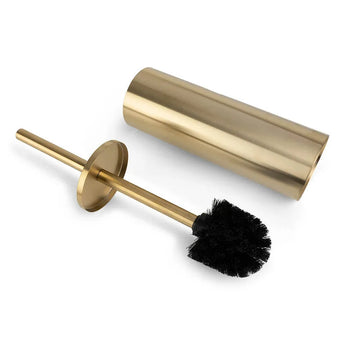La brosse de toilette Bruno Gold de yessential.fr, avec des poils noirs et un support cylindrique doré, se tient debout à côté de son support assorti sur un fond blanc.