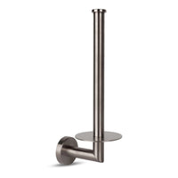 Doté d'une base ronde et d'un design en métal, le porte-rouleaux de rechange Roberto Gunmetal de yessential.fr ajoute une touche élégante à votre espace tout en gardant les rouleaux de papier toilette bien organisés.