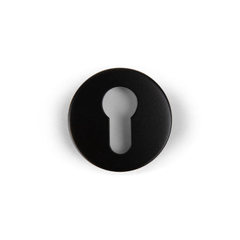 Les Rosettes Black de yessential.fr sont un blason rond noir avec une découpe centrale en trou de serrure, vu dessus sur un fond blanc.