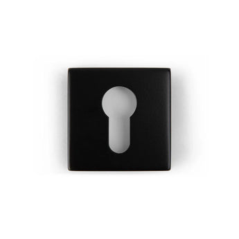 Le Rosettes Black de yessential.fr est une plaque à clé carrée noire avec un trou de serrure central, représentée sur un fond blanc.