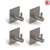 Quatre crochets à serviettes yessential.fr 4x Navarro Gunmetal avec plaque carrée sont disposés en grille ; un symbole rouge « pas de perçage » en haut à droite indique que ces crochets autocollants peuvent être installés rapidement sans perçage.