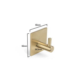 Le crochet à serviette Navarro Gold de yessential.fr a une base carrée dorée (45x45 mm) et une broche cylindrique (26,5 mm), illustrées sur fond blanc. Parfait comme crochet à serviettes élégant et autocollant pour votre salle de bain.